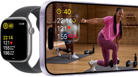 Apple Watch next to iPhone with Apple Fitness+ class on screen
